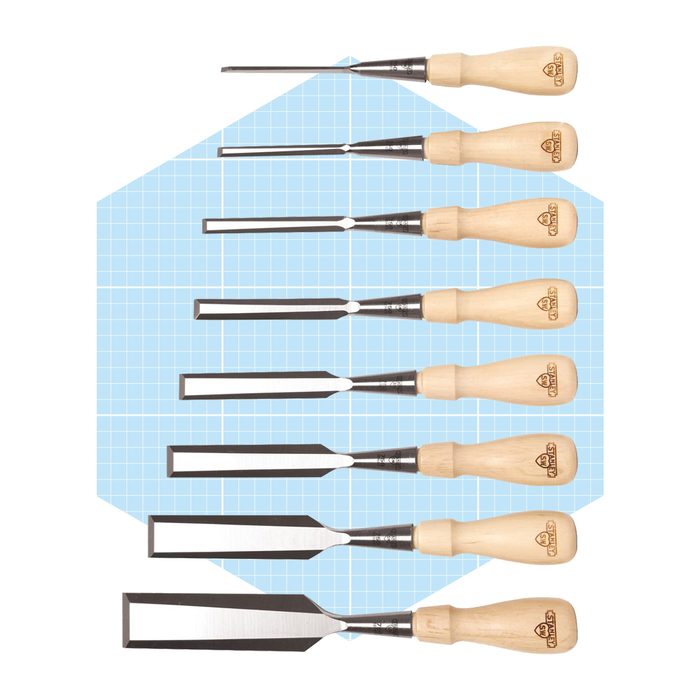 Chisels with wooden handles are neatly arranged in a row on a light blue grid background, showcasing various blade widths and shapes.