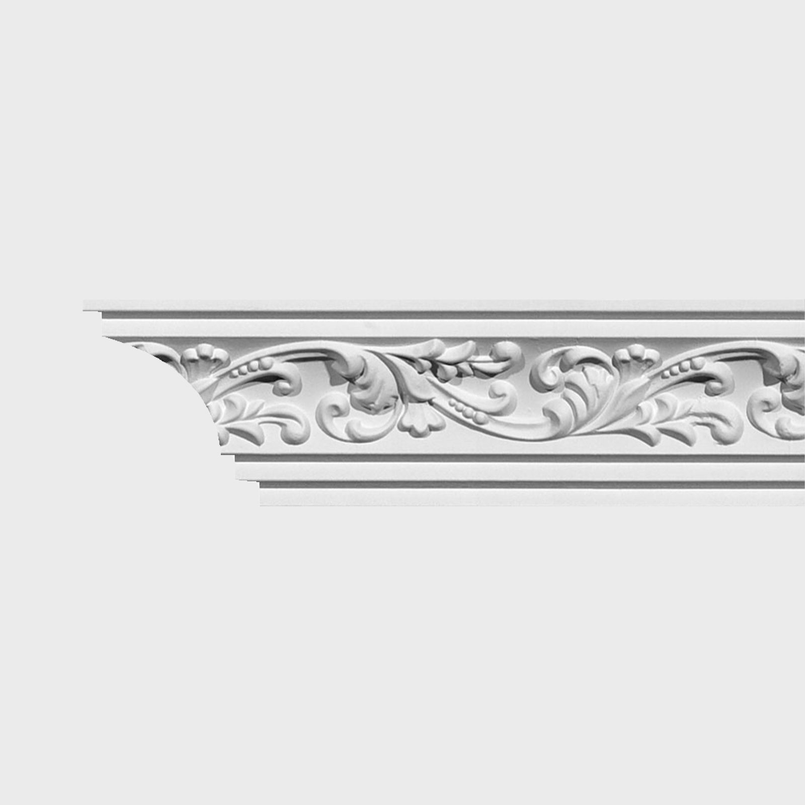 A white decorative crown molding features intricate floral designs, accentuating the top of a wall in a refined interior setting.