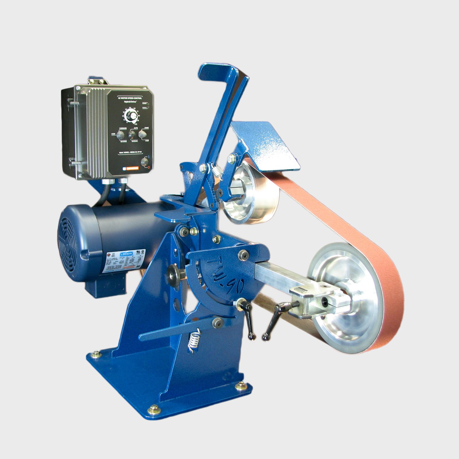 A small, blue machine operates a rotating sanding belt, used for sharpening or polishing, positioned on a flat surface against a neutral background.
