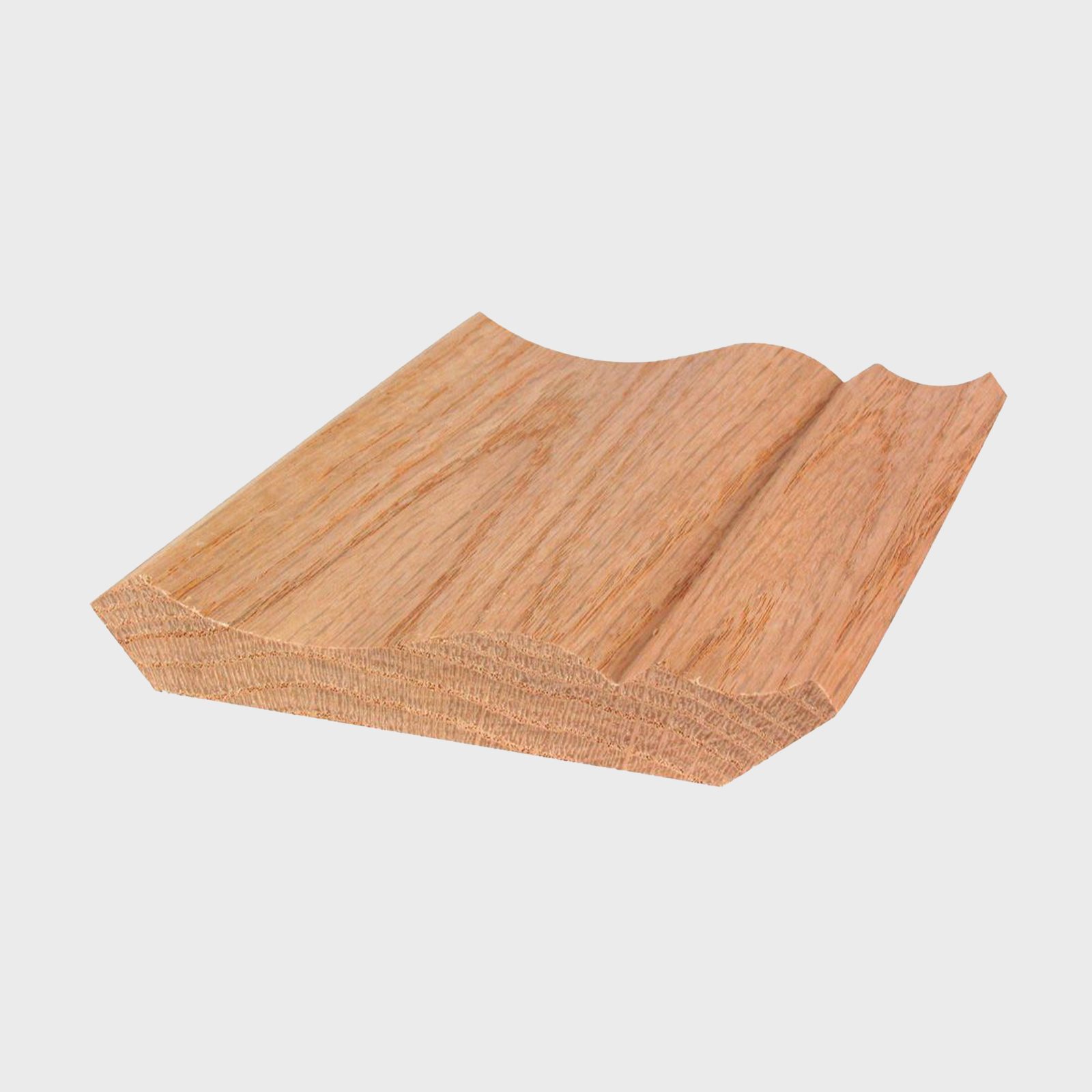 A wooden molding lies flat, showcasing a smooth, curved edge. It is surrounded by a plain white background, emphasizing its natural grain.