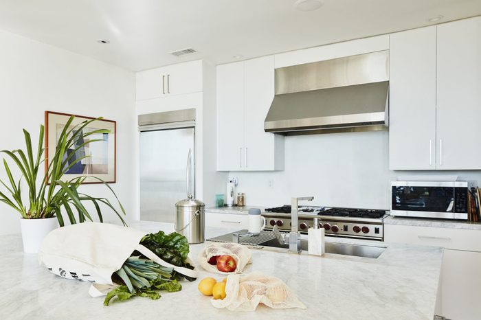 Groceries in canvas bag on kitchen counter in home