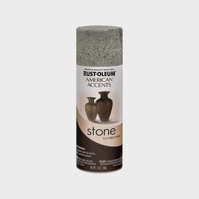 A spray can is positioned upright, labeled as 