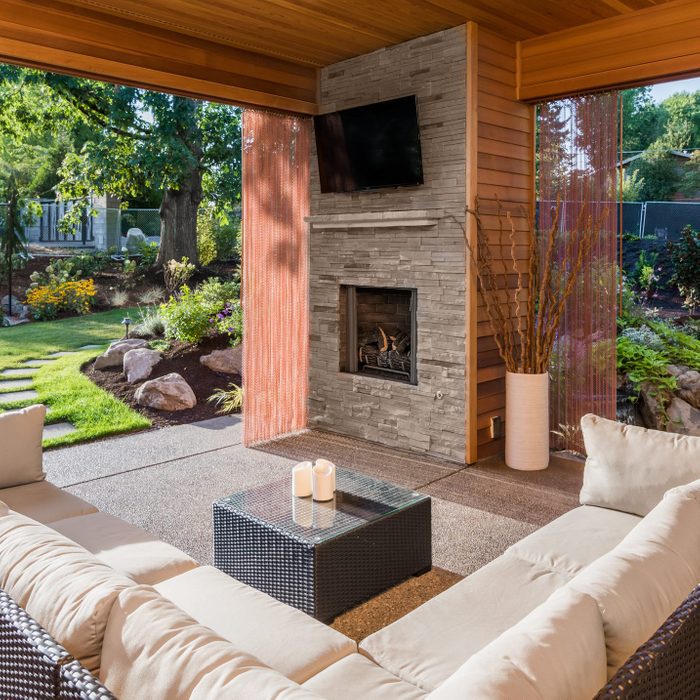 Covered patio exterior behind new luxury home