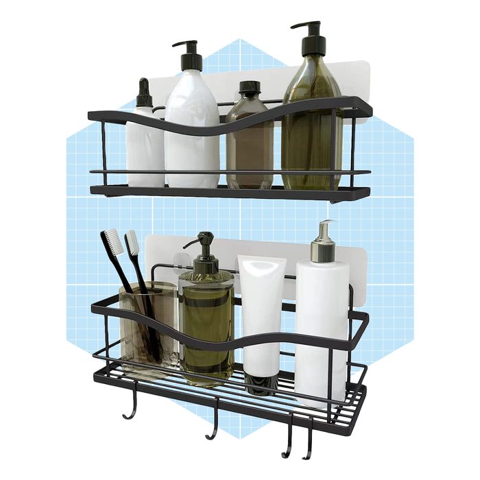 Two metal shelves hold various bottles and toothbrushes, organized neatly against a light blue grid background. The shelves are wavy in design.