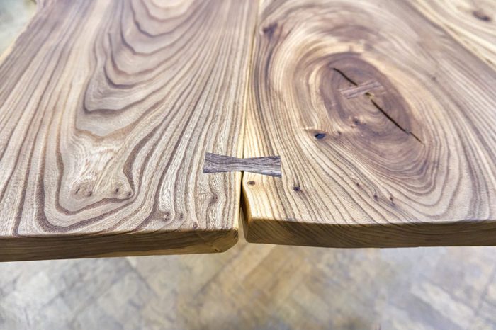 Live edge elm slab table with bow tie joint