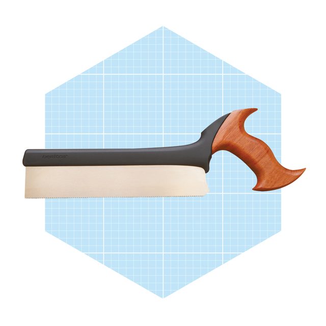 A hand saw rests horizontally, featuring a wooden handle with a distinct curve. A light blue, grid-patterned hexagon serves as the backdrop.