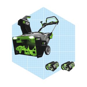 An electric snowblower features a throwing chute and two batteries, set against a light blue grid background, designed for efficient snow removal.