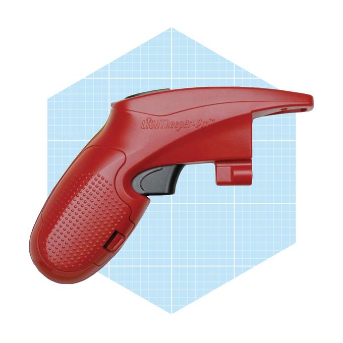 A red light tester grip with textured surface is positioned against a blue grid background, designed for checking and fixing light strings.