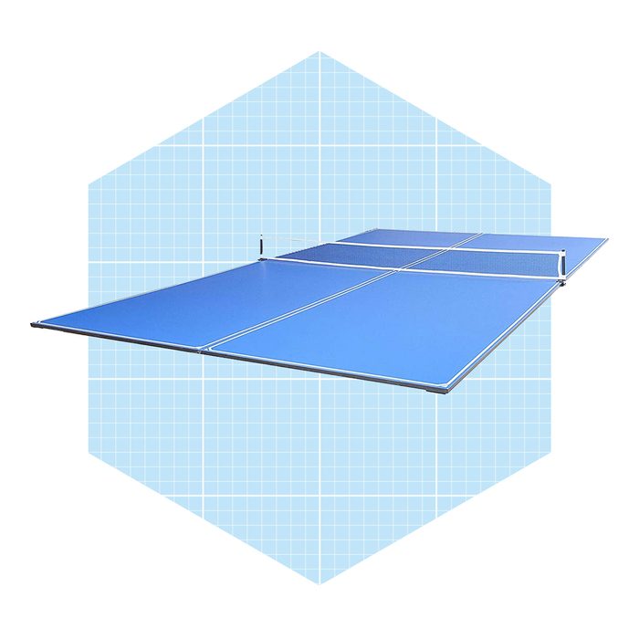 A blue table tennis table is positioned flat, with a net at the center, set against a light blue grid background.