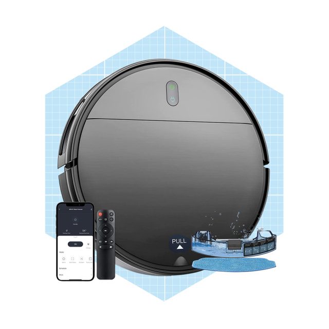 A round, black robotic vacuum is displayed alongside a smartphone and remote, suggesting remote cleaning control in a bright, grid-patterned background.