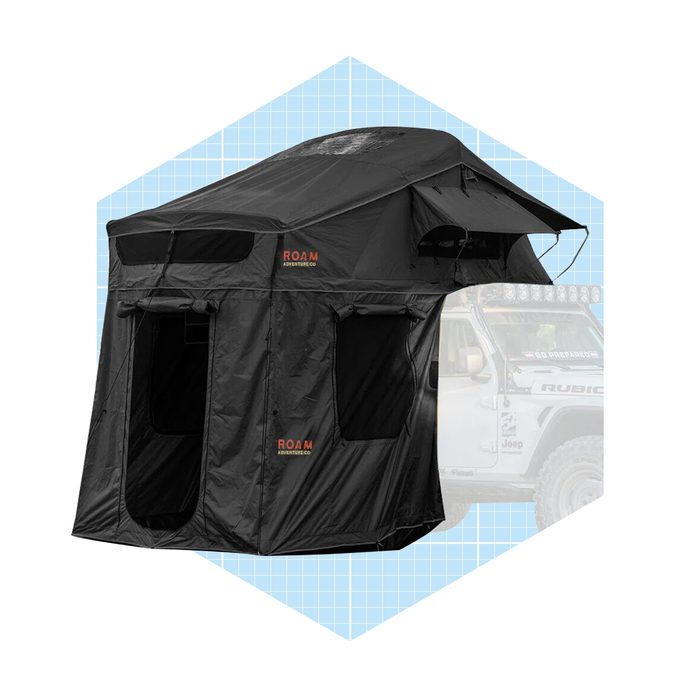 A black rooftop tent sits atop a vehicle, featuring multiple windows. It's designed for outdoor adventures, set against a blue geometric background.