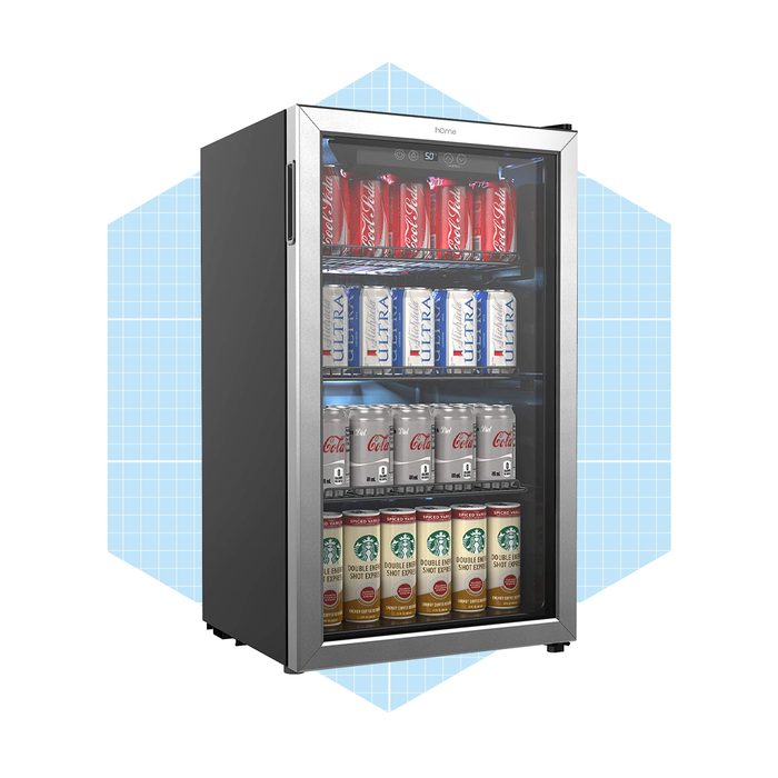 A sleek, glass-front refrigerator displays various canned drinks, organized on shelves within a light blue geometric backdrop.