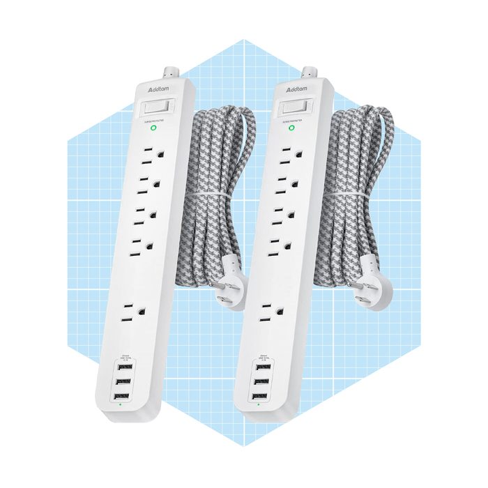 Two power strips with multiple outlets and USB ports are displayed, connected by grey braided cords, set against a light blue geometric background.