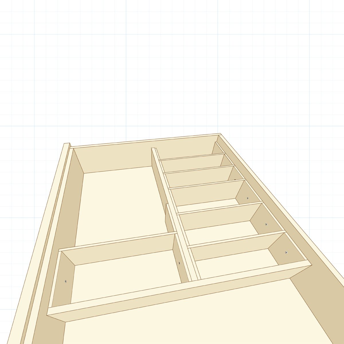 A wooden drawer interior features several compartments and dividers, designed for organizing items, set against a graph paper background.