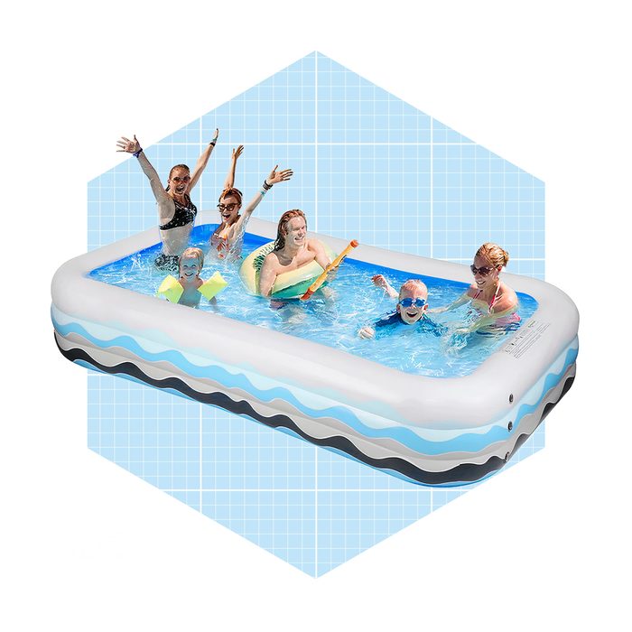 A large inflatable pool holds five people playing and splashing water, surrounded by a light blue grid background, conveying a fun summer atmosphere.