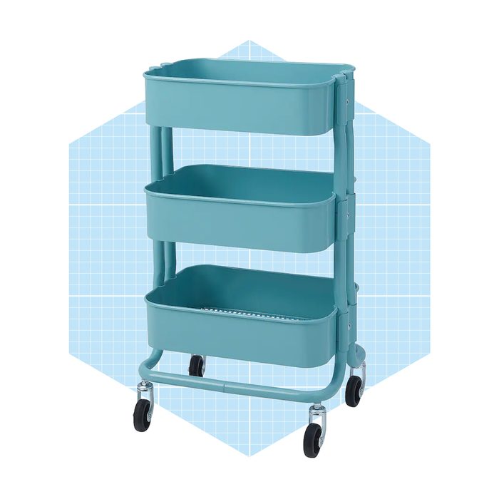A teal, three-tiered rolling cart stands upright, designed for storage, against a light blue grid background, emphasizing its organizational function.