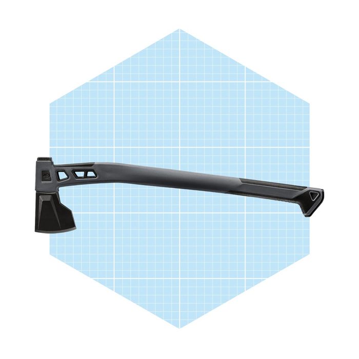 A black axe rests horizontally against a light blue grid-patterned background, showcasing its sleek design and sharp blade, emphasizing its intended cutting function.