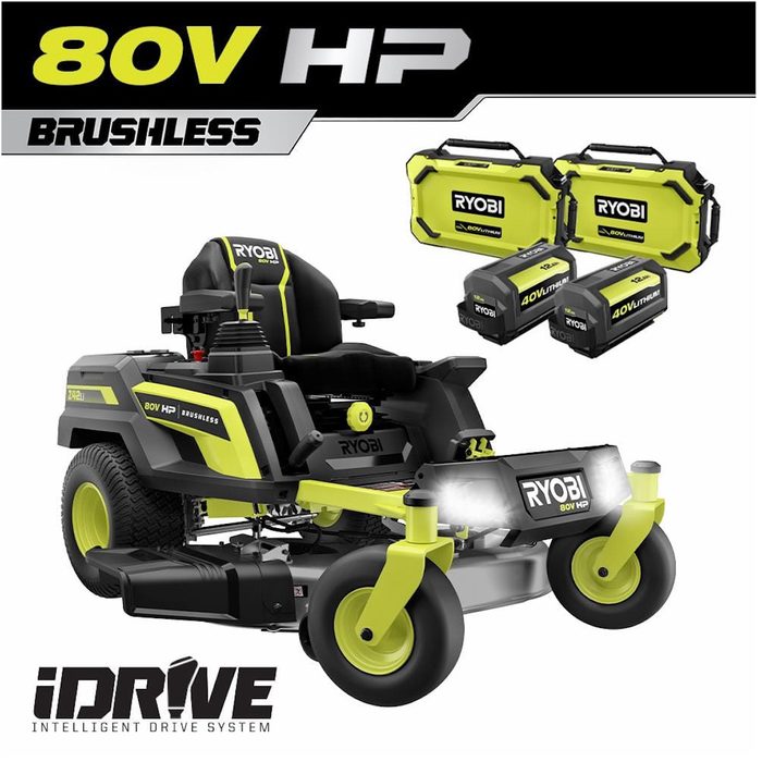 A riding lawn mower stands prominently with bright green and black colors, featuring a seat, controls, and batteries, set against a simple background.