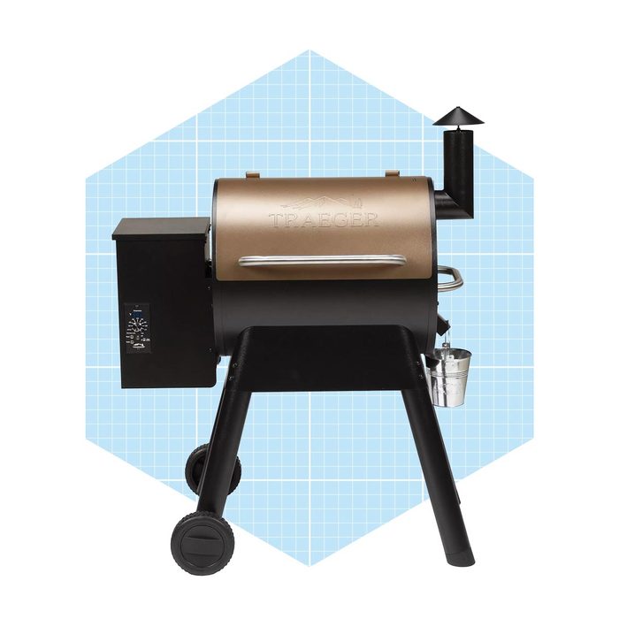 A black and gold pellet grill stands on wheels, with a digital control panel and a chimney, set against a light blue grid background.