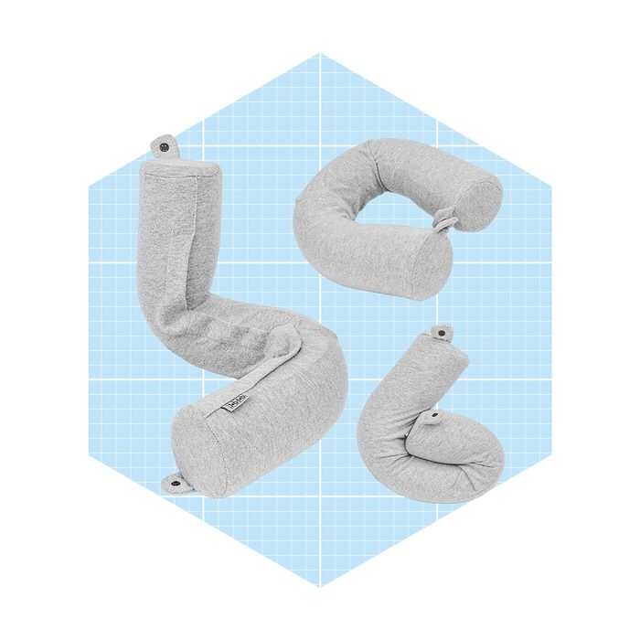 A flexible, gray cushion is shaped in various forms on a light blue grid background, suggesting adaptability for comfort and support in different positions.