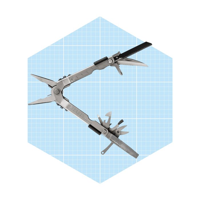 A multi-tool device features pliers and various tools, positioned against a light blue grid background, ready for use in various tasks or repairs.