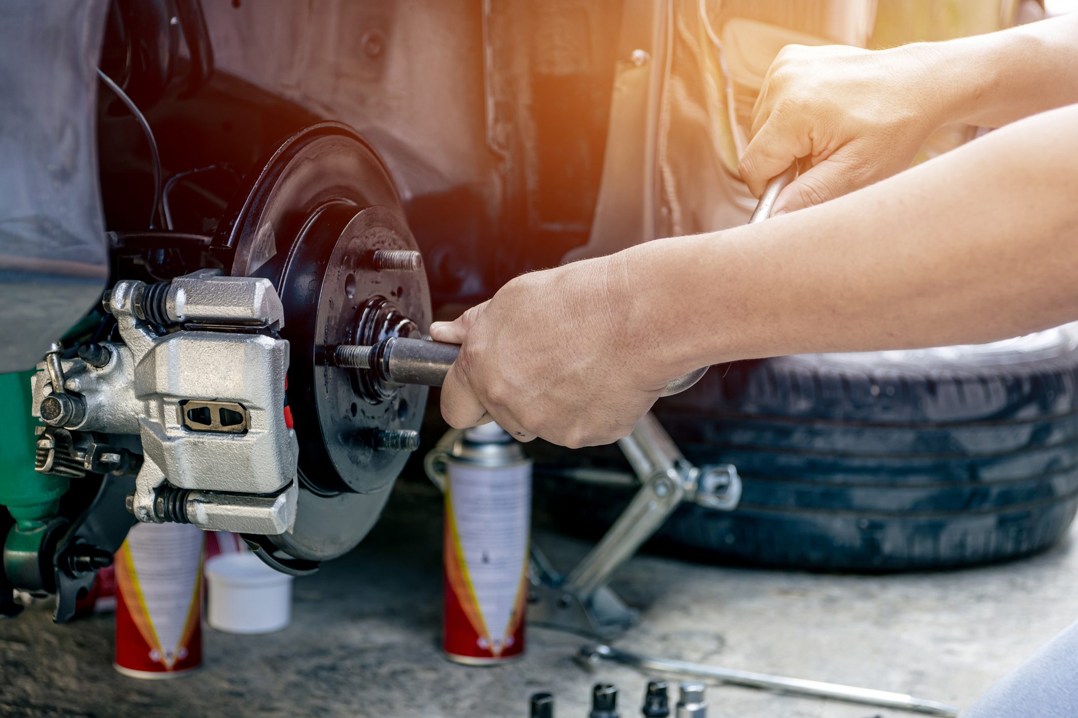 Close up hand a man repairing and Simple test bolt of car wheel after repair paint and maintenance that can be made by yourself