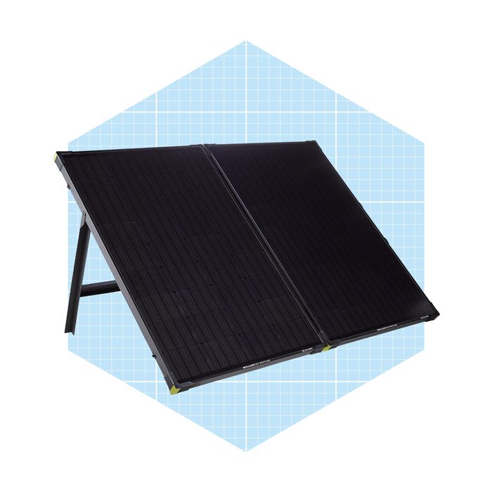 A solar panel is angled to collect sunlight, set against a light blue hexagonal background with a grid pattern, suggesting a technology or design theme.