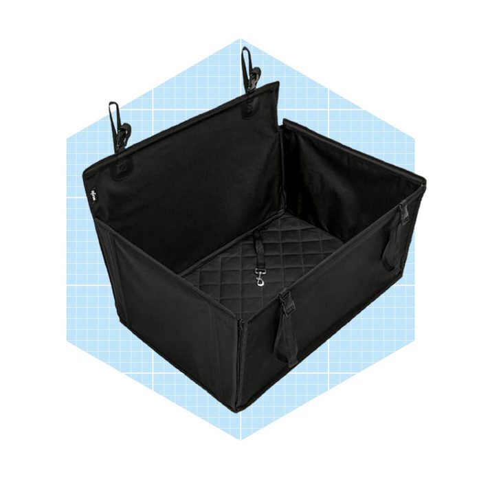 A black storage bag sits open, featuring a quilted base and handles, against a light blue grid background. It is designed for organizing items.