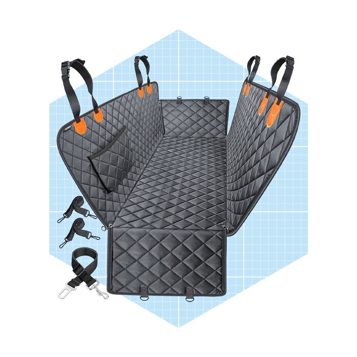 A black quilted pet car seat cover is displayed, featuring adjustable straps and a pocket, designed to protect car interiors during pet travel.