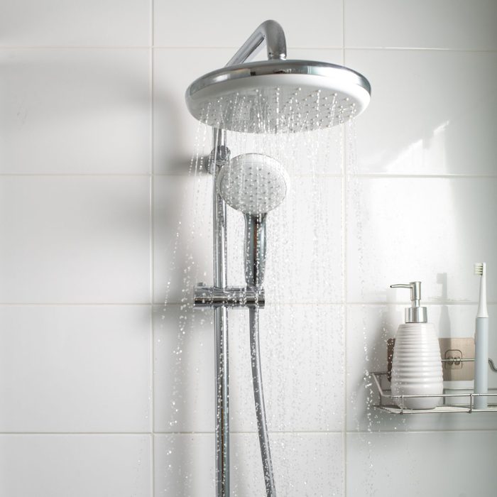 Jets of clean water flowing in the shower cabin.