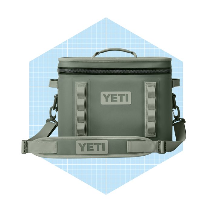 A green cooler bag with a zippered top displays 
