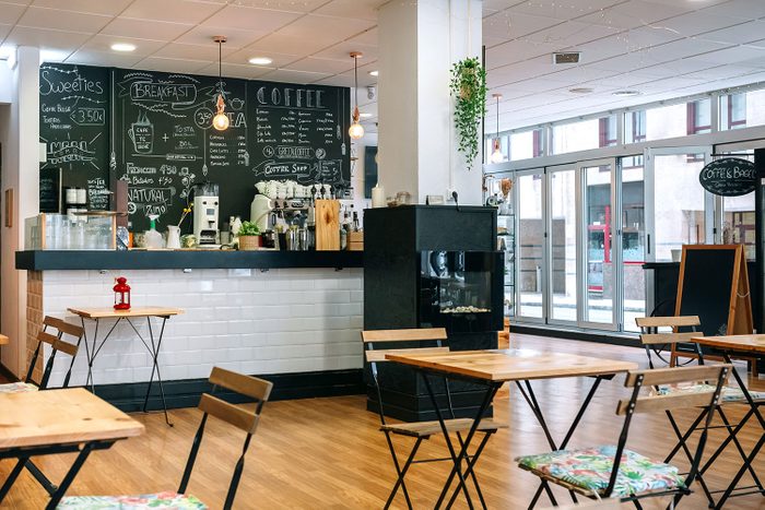 Empty Cafe Interior With Chairs And Tables