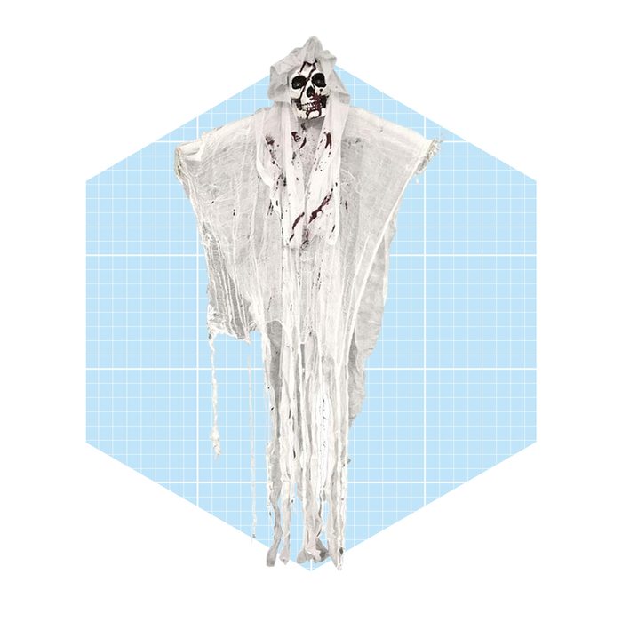 A tattered white ghost figure hangs, resembling a spooky apparition, against a light blue grid background, creating a haunting atmosphere.