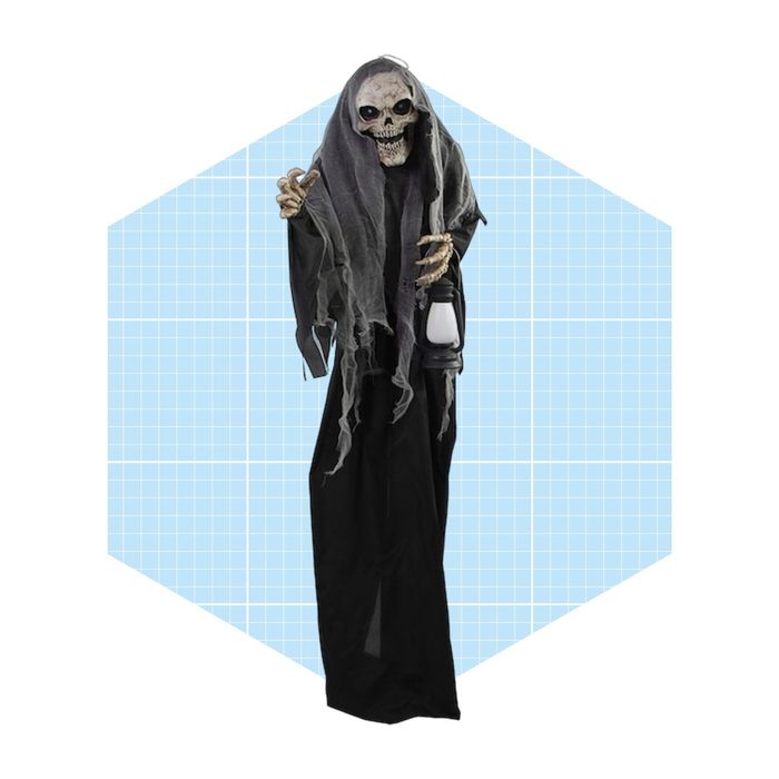A skeleton in tattered robes holds a lantern, standing against a light blue geometric background, evoking a spooky, Halloween theme.