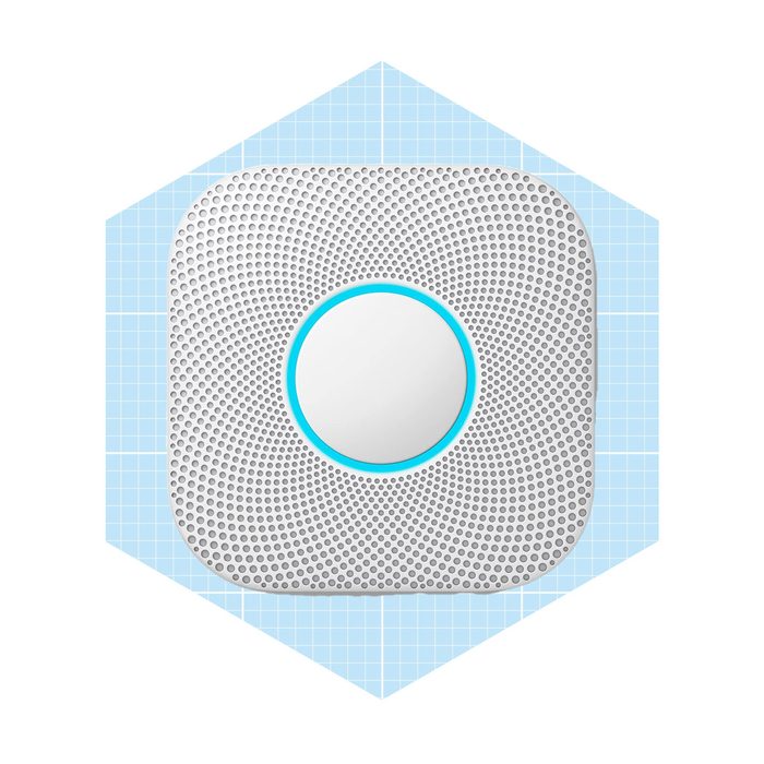 A round, textured smoke detector is positioned within a blue hexagonal background, emphasizing its safe indoor functionality.