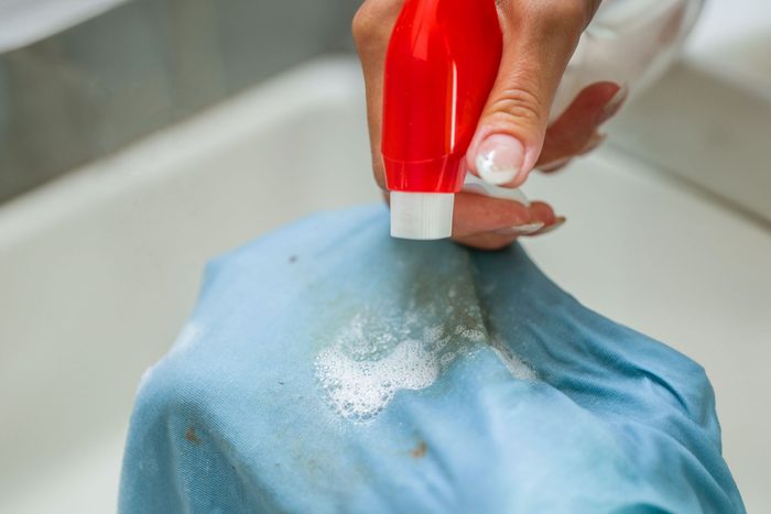 spraying on stain remover