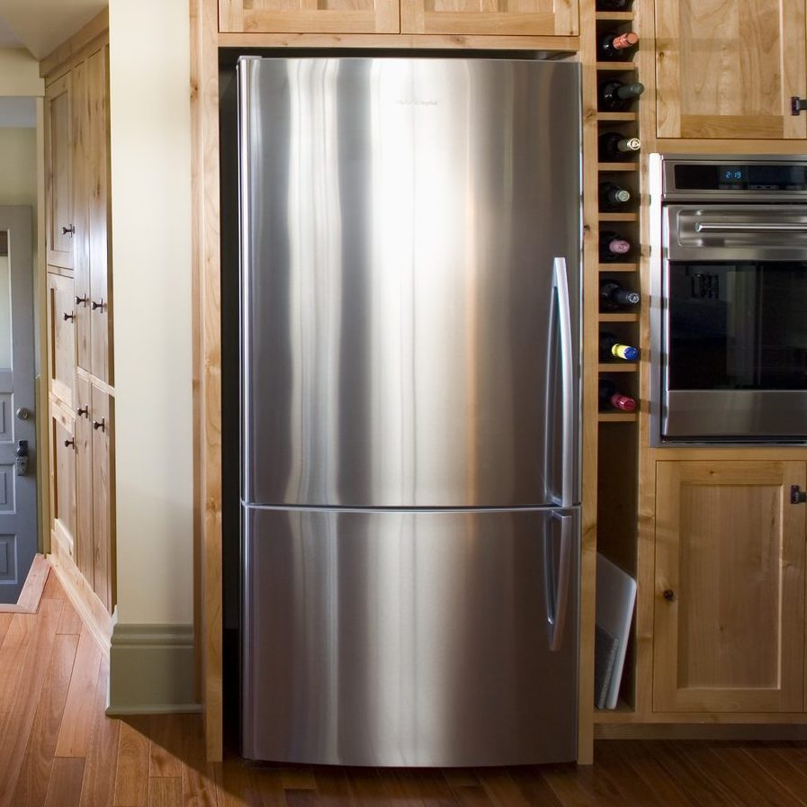 Back Door in Kitchen With Built-In Wood Cabinets