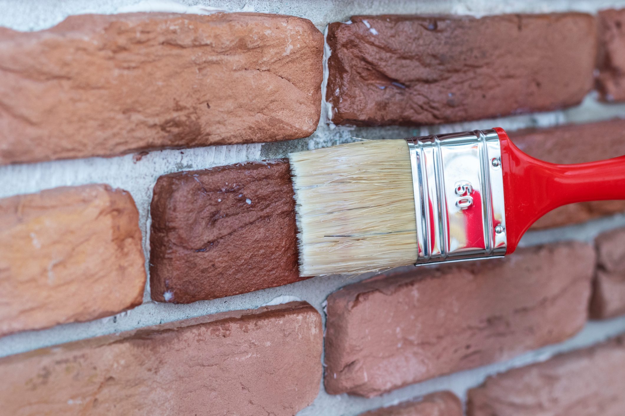 Covering of a decorative plaster tile with protective varnish.