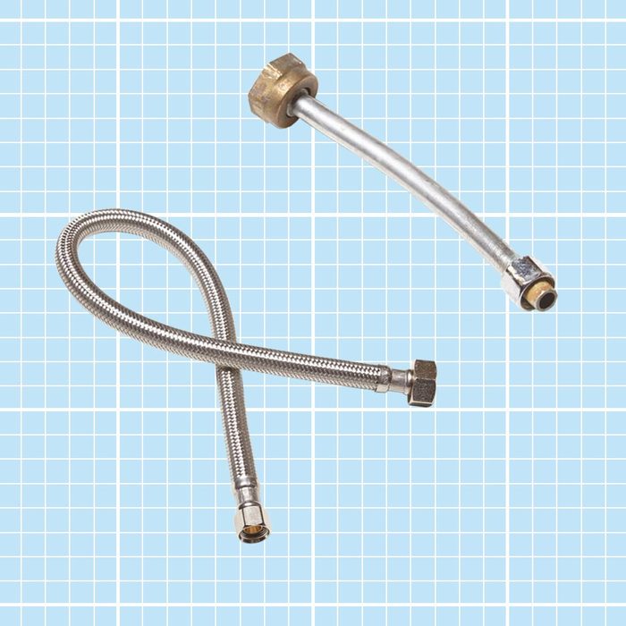 flexible pipe and steel pipe on blue grid background