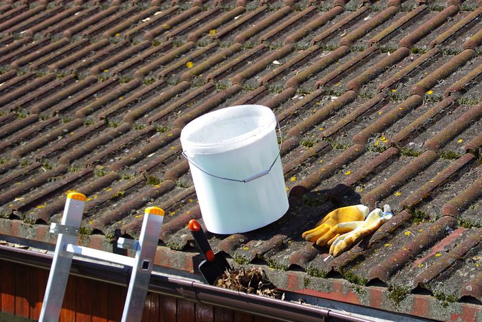 bucket on a roof near gutters