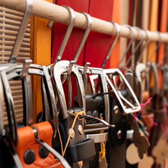 belts hanging on s hooks