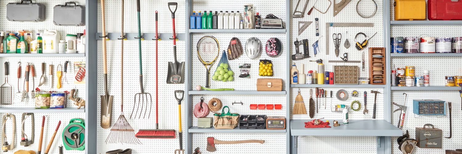 Organizized home garage with a peg board wall