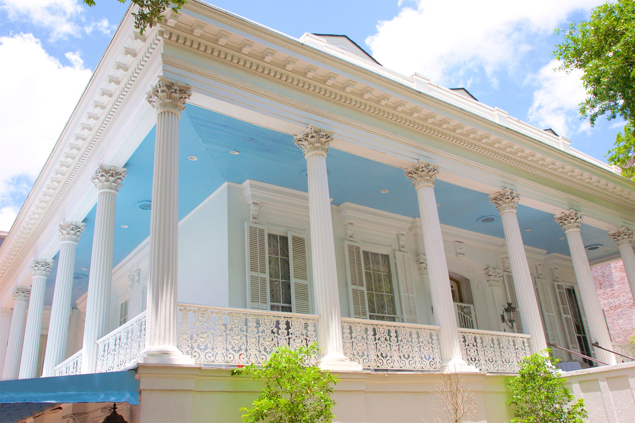 New Orleans mansion with exterior columns and a blue porch ceiling